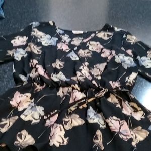 Flowered blouse banded around waste very flattering